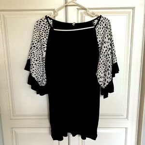 Beeaon River top. Animal print sleeves with ruffle.